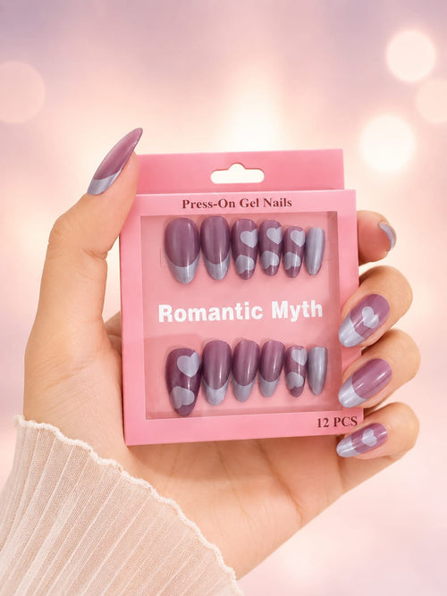 Romantic Myth press-on gel nails held in hand showing heart design