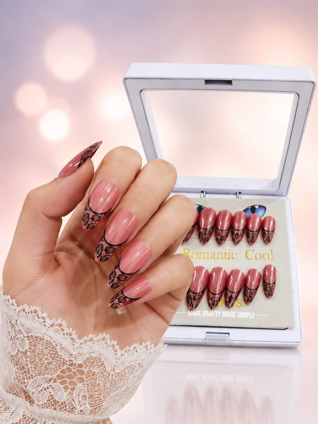 Hand wearing Romantic Cool press-on nails with compact case